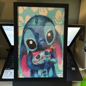 Completed stitch and doll diamond art framed added glue sealant